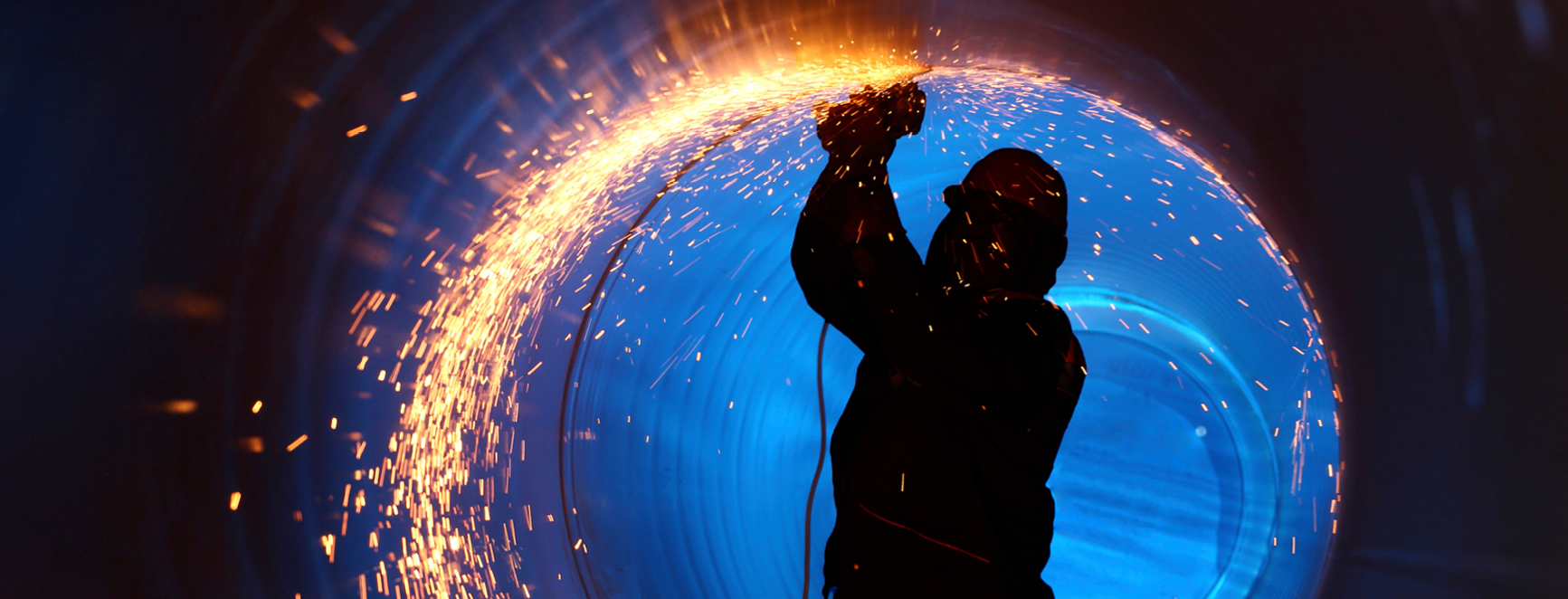 Industrial worker carrying out hot work in a fabrication environment